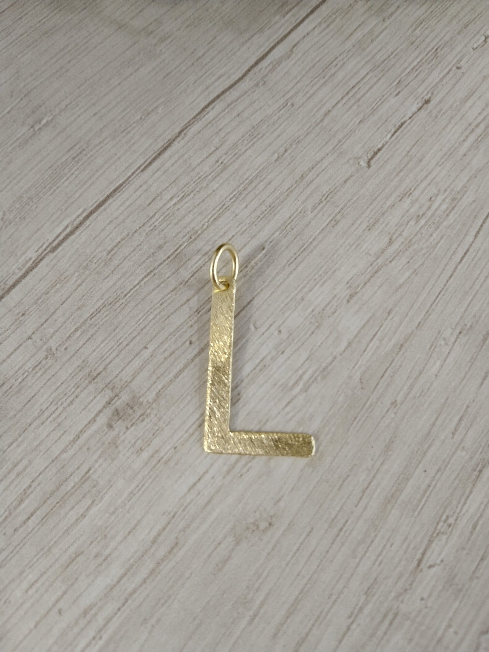 Letra ba?o en oro L