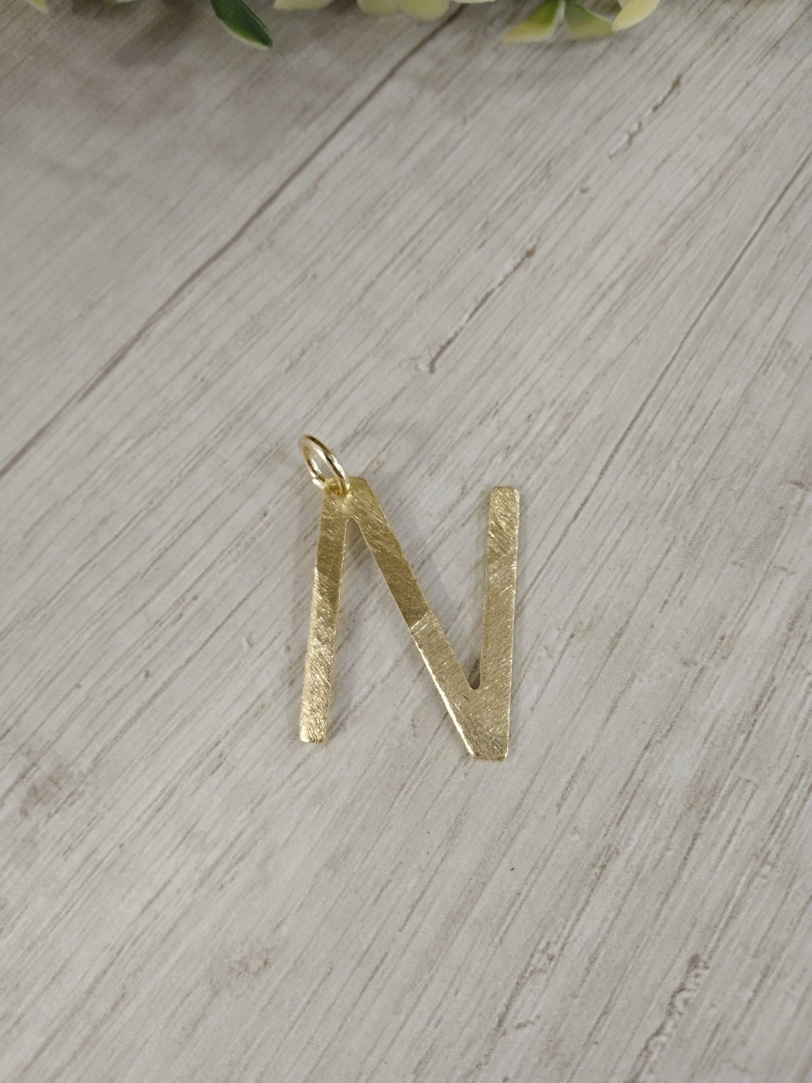 Letra ba?o en oro N