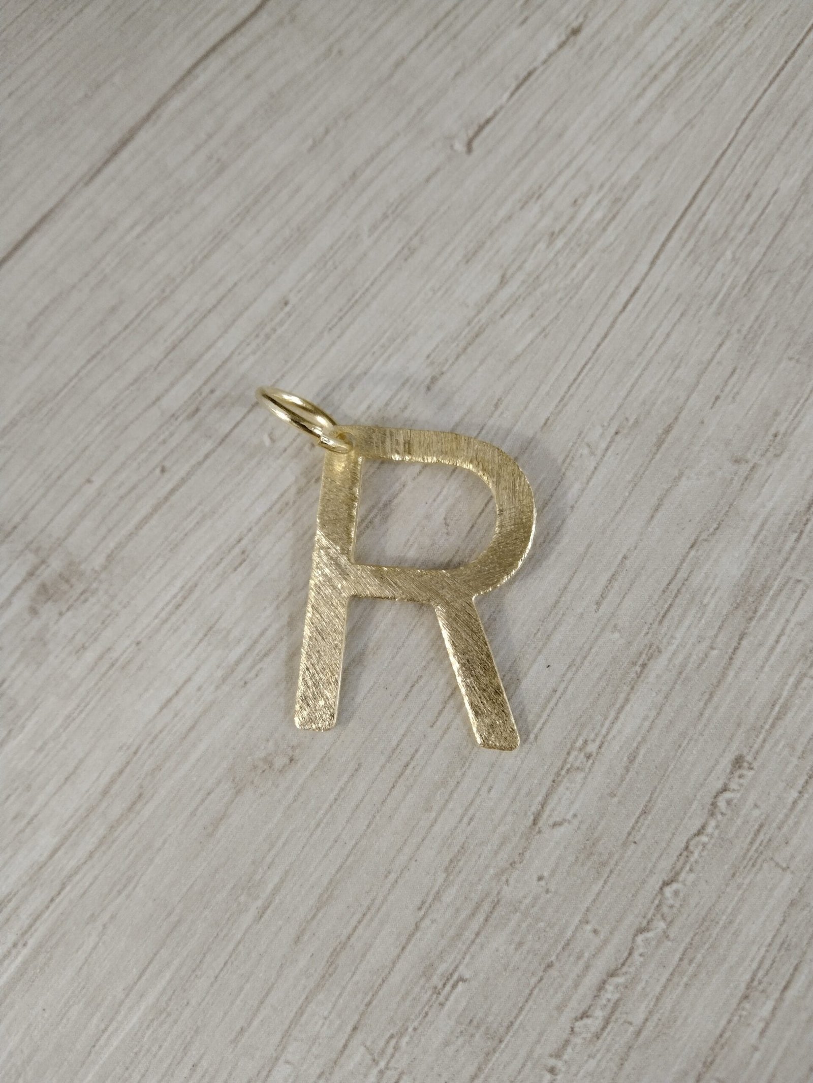 Letra ba?o en oro R