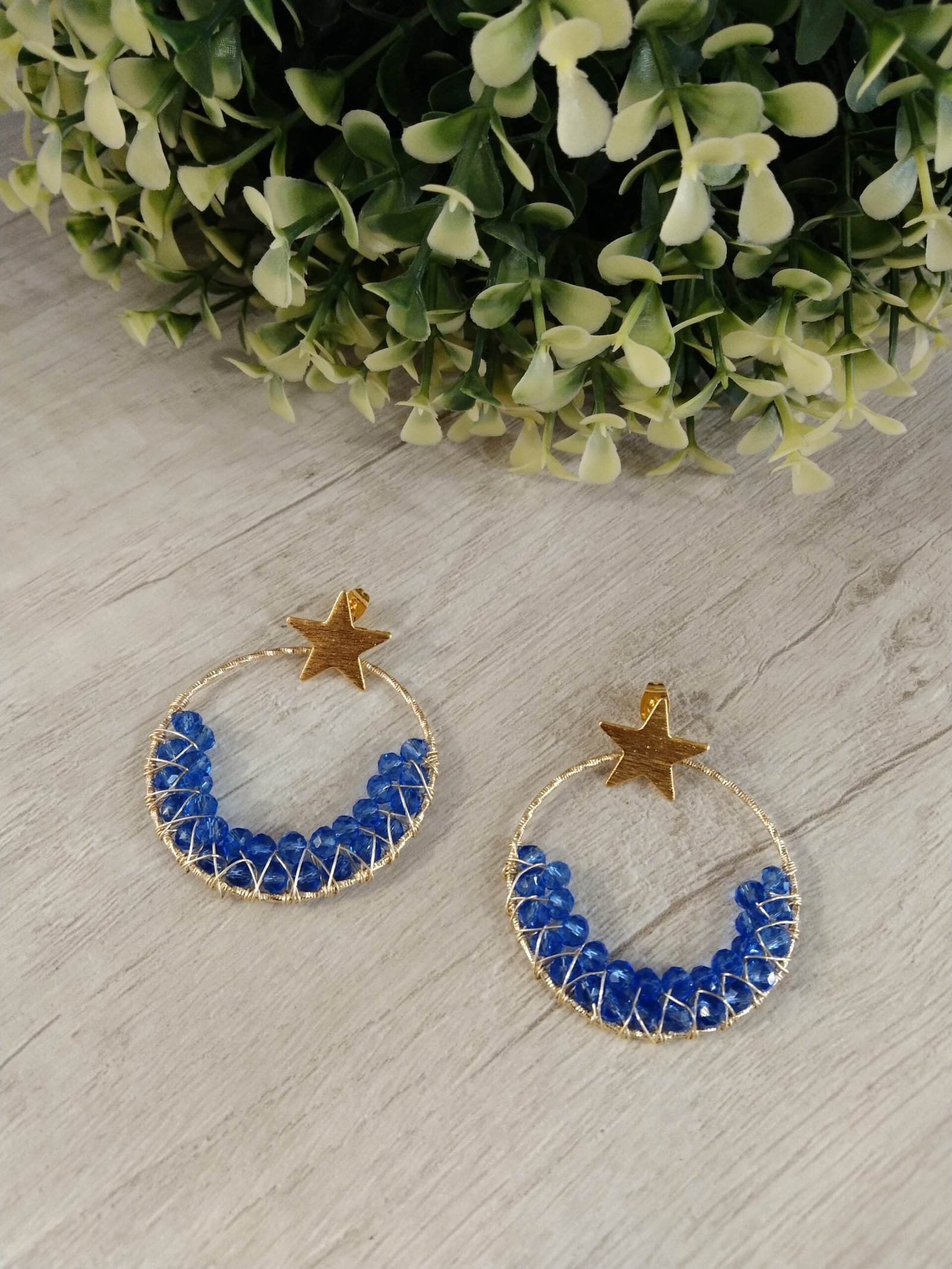 Aros ba?o en oro argolla con estrella apegada y cristales