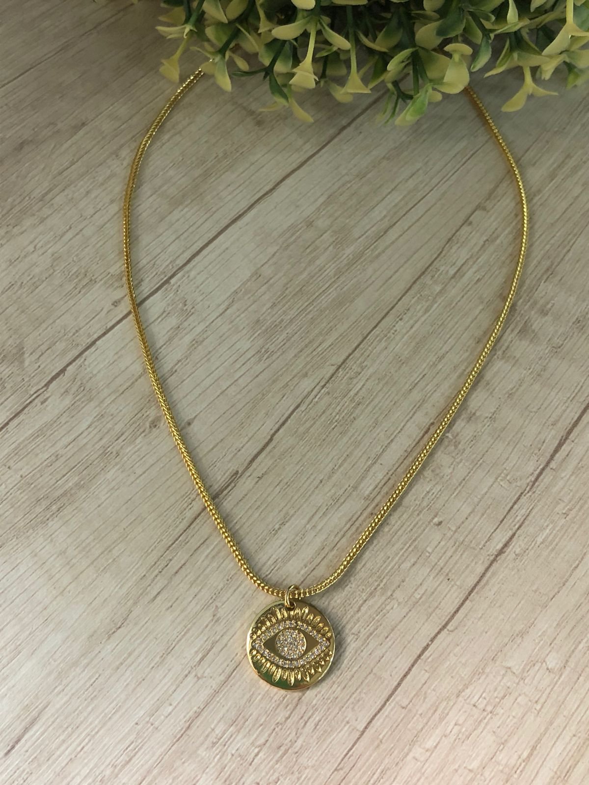 Collar ba?o en oro con doje ojo turco