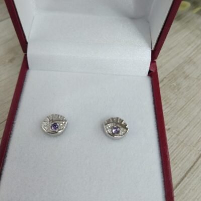 Aros plata rodinada ojo circon morado