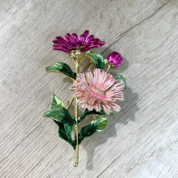 Prendedor ramo flores fucsia/rosa