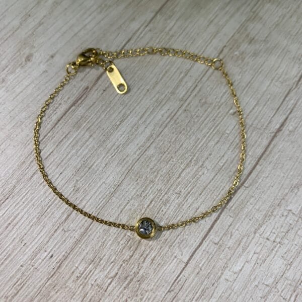 Pulsera acero punto de luz dorado