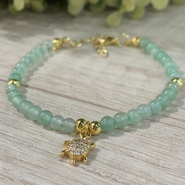Pulsera Jade Dije tortuga baño oro