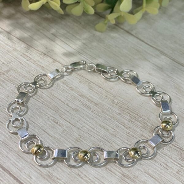 Pulsera Plata con oro argollas