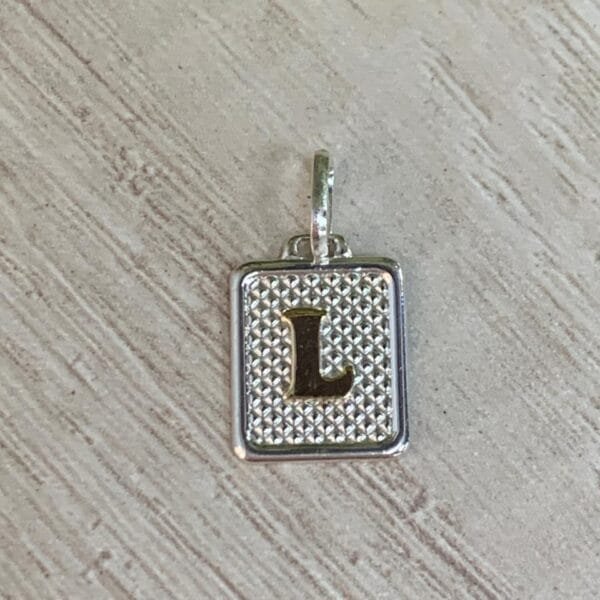 Colgante plata letra L con oro