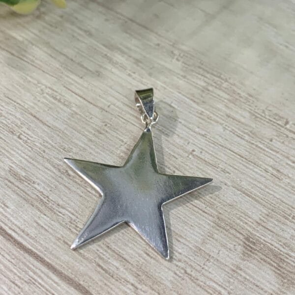 Colgante plata Estrella lisa 30x30mm