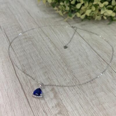 Collar plata rodinada punto de luz azul triangular