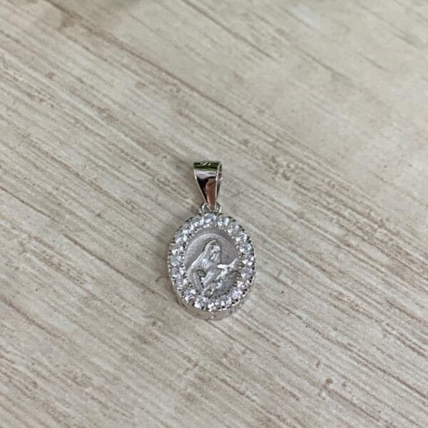 Colgante plata rodinada Santa Rita circones