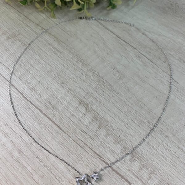 Collar plata rodinada doble estrella circones