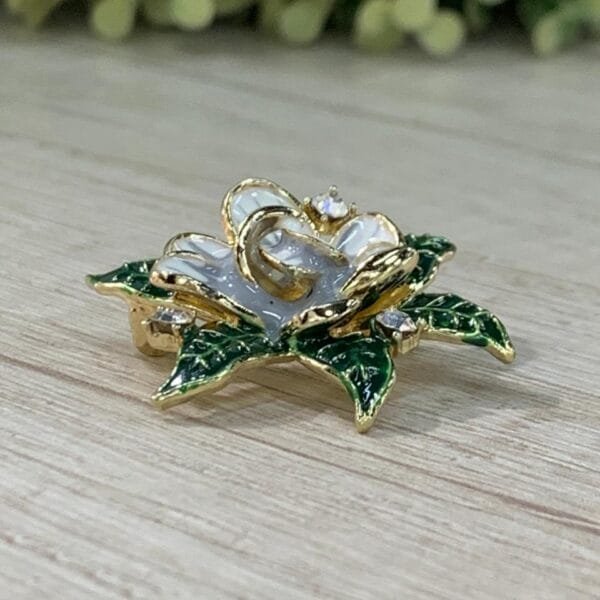 Prendedor flor circon esmaltado