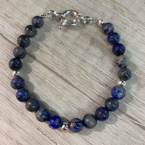 Pulsera plata lapislazuli broche timon esferas 18 cm