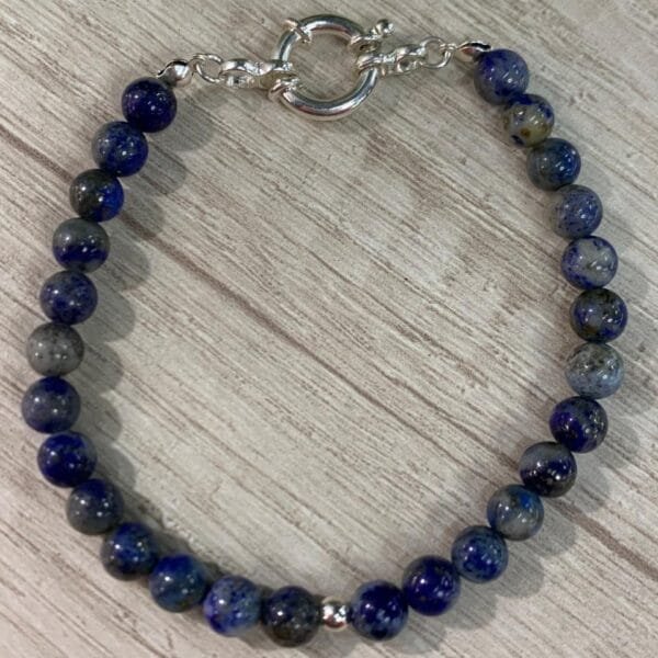 Pulsera plata lapislazuli broche timon una esfera 22 cm