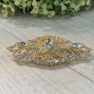 Prendedor vintage blanco dorado alargado