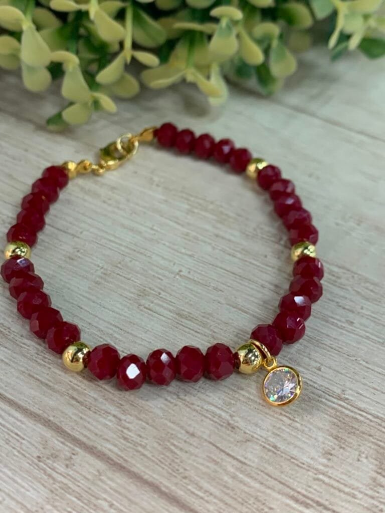 Pulsera baño en oro cristales burdeo con circon